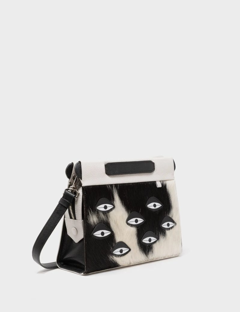 Vali Crossbody Small Cream Leather Bag - Eyes Applique Adjustable Handle - Front corner angle view